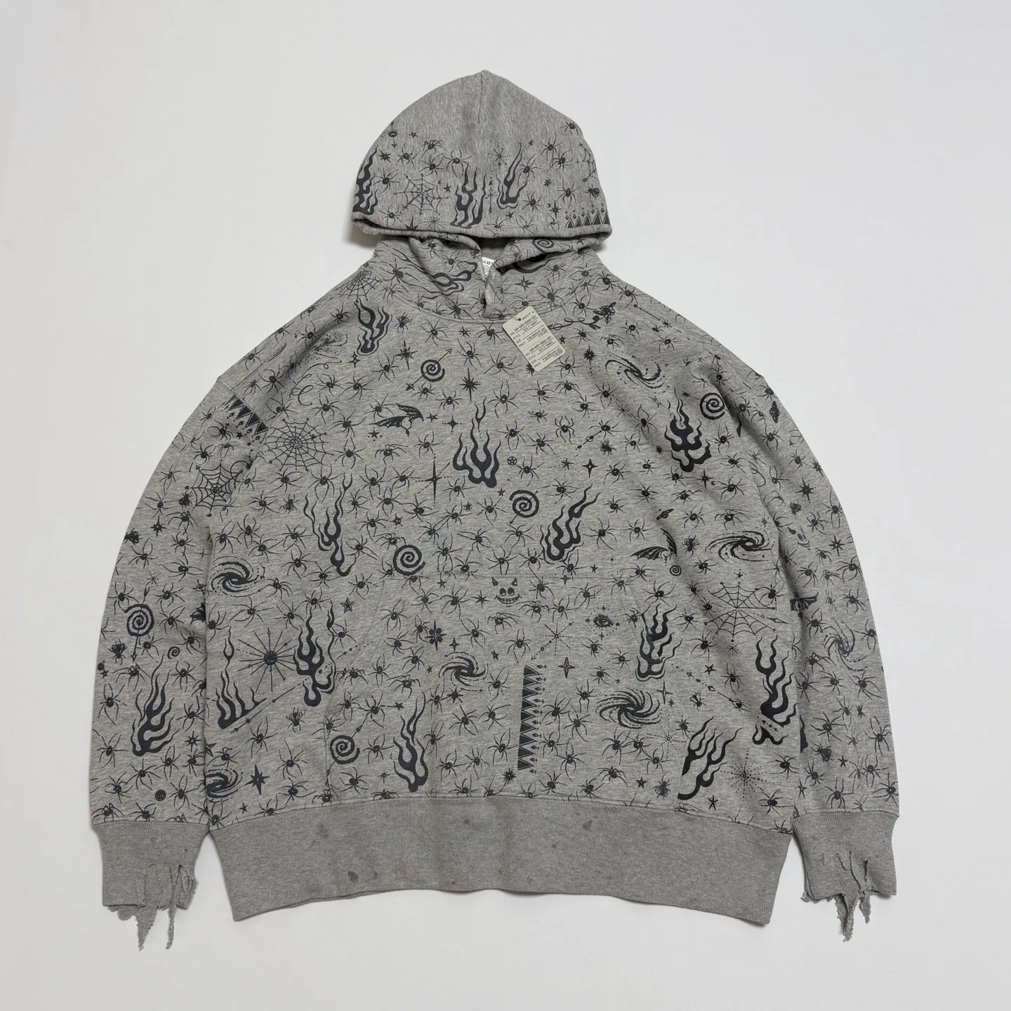 More accessories details SAINT Mxxxxxx x DR. WOO HOODIE ' Dr.Woo ' /GRY Flame Swirl Spider Web Hoodie Distressed Gray S-XL Custom-woven and dyed nostalgic gray fabric. After printing, the garment is sprayed with potion to make the fabric oxidize and fade, plus a large number of artificial fabric destruction processes, making the whole piece of clothing look old and unique as a work of art. This hoodie is co-branded with a famous tattoo design artist. A full set of Dr.Woo accessories has been customized. Bringing you authentic items!